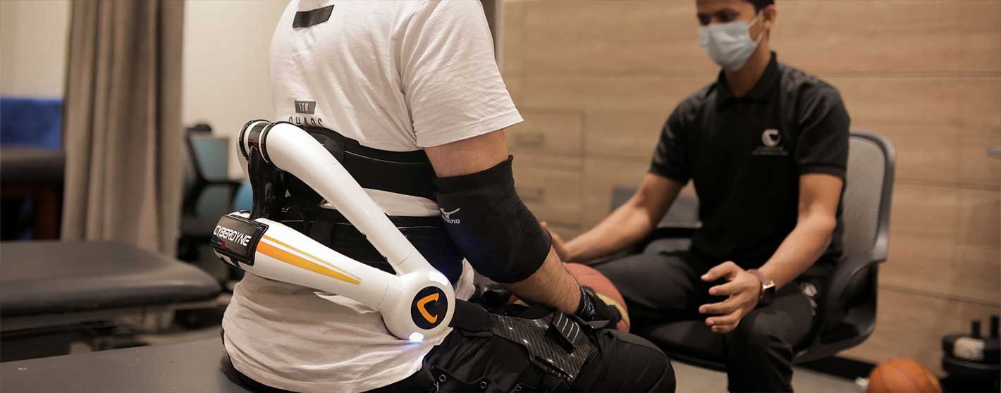 Patient using rehabilitation equipment in a therapy session